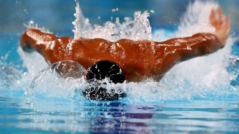 In this Oct 2, 2012 photo, Jason Dunford of Kenya competes in the men's 50 butterfly during the FINA/ARENA Swimming World Cup 2012 in Dubai. /AFP