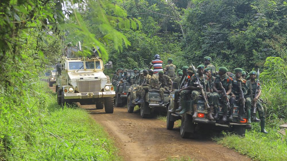 FILE PHOTO: Congolese Defense Forces soldiers and United Nation forces patrol an area near the town of Oicha, 30 kms (20 miles) from Beni, Democratic Republic of Congo. /AP