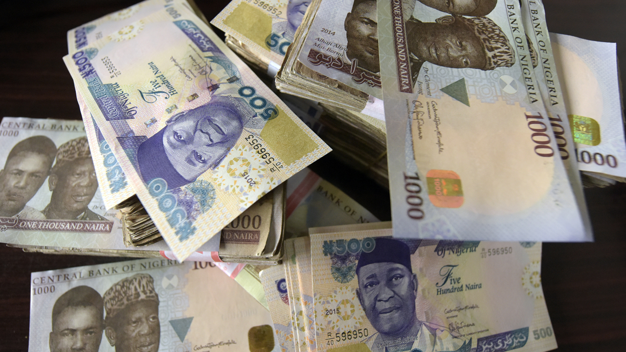 This file photo shows shows naira banknotes, Nigeria's currency. / AFP