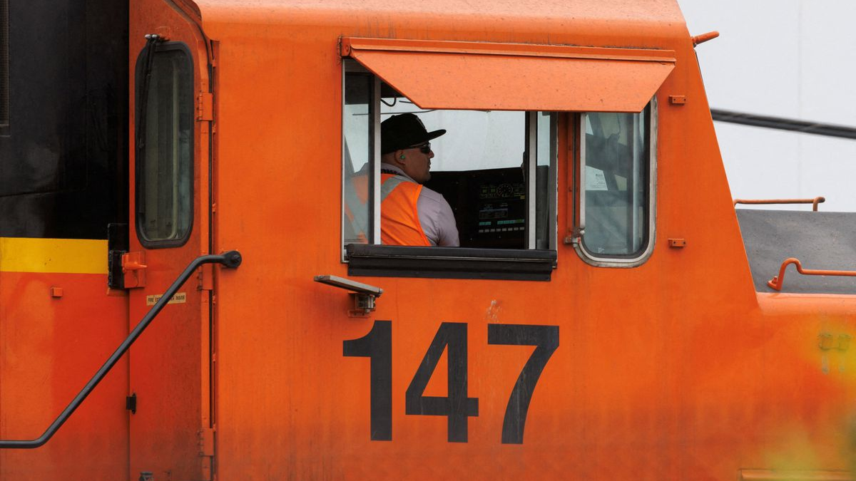 A railway worker drives a train engine while loading railcars in San Diego, California, U.S. November 30, 2022. /REUTERS
