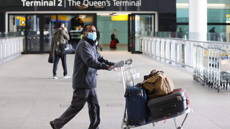 Passengers walk in Heathrow Airport in London, Britain, March 18, 2022. /Xinhua