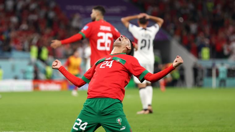 Badr Benoun of Morocco celebrate in a World Cup clash against Portugal. /Getty Images
