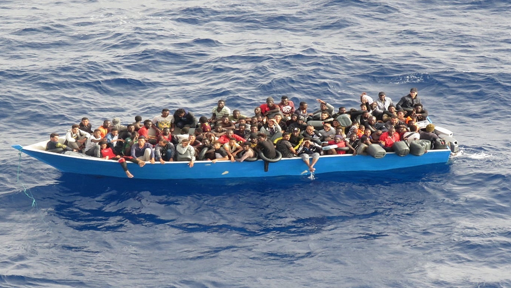 Migrants are seen on a boat off the coast of Libya, July 18, 2021. /CFP