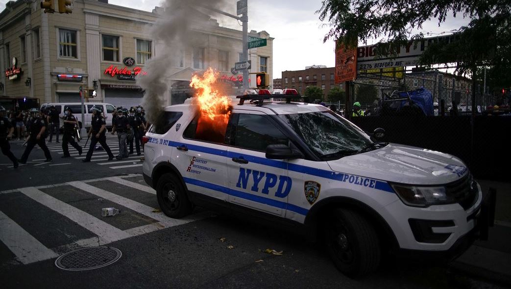 FILE PIC: New York Police Department vehicle set a blaze. /AFP