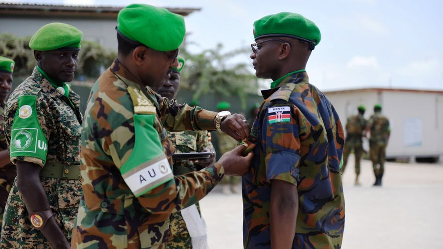 FILE PIC: Tigabu Yilma (L, front), African Union Mission in Somalia (AMISOM) Force Commander pins a medal on a Kenyan AMISOM military officer during a medal award ceremony in Mogadishu, capital of Somalia Sept. 29, 2019. /Xinhua