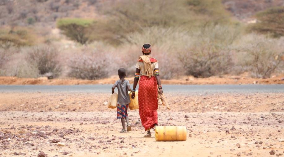 FILE PIC: A woman and her child going to fetch water in one of the arid areas in Kenya. /Xinhua