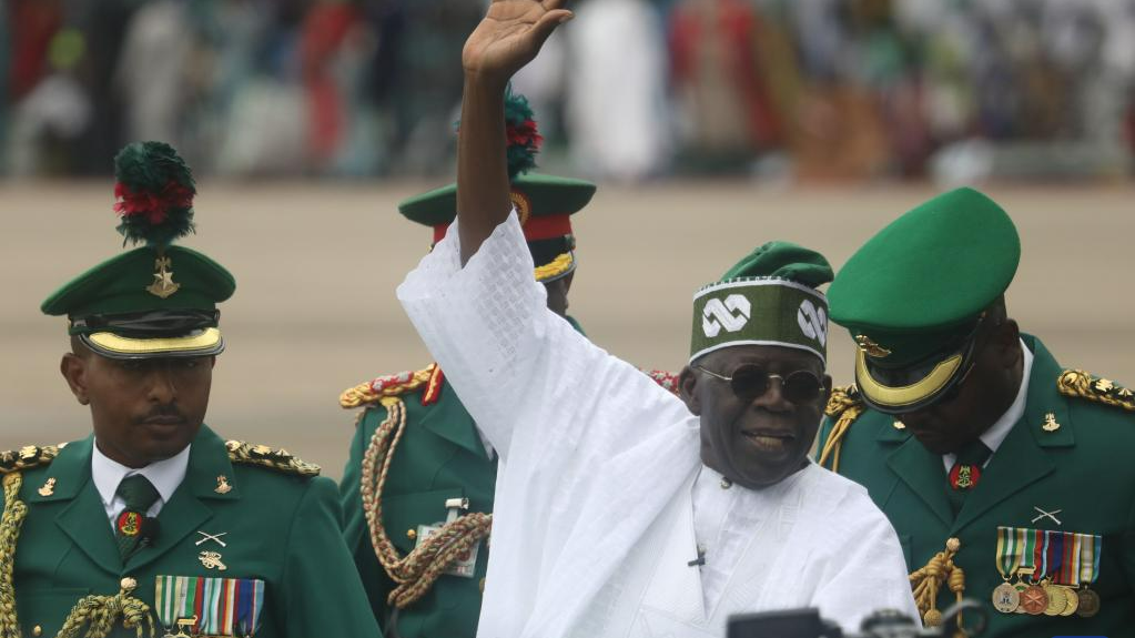 Bola Ahmed Tinubu (Front) waves to people after being sworn in as Nigeria's new president at a ceremony in Abuja, Nigeria, on May 29, 2023. /Xinhua