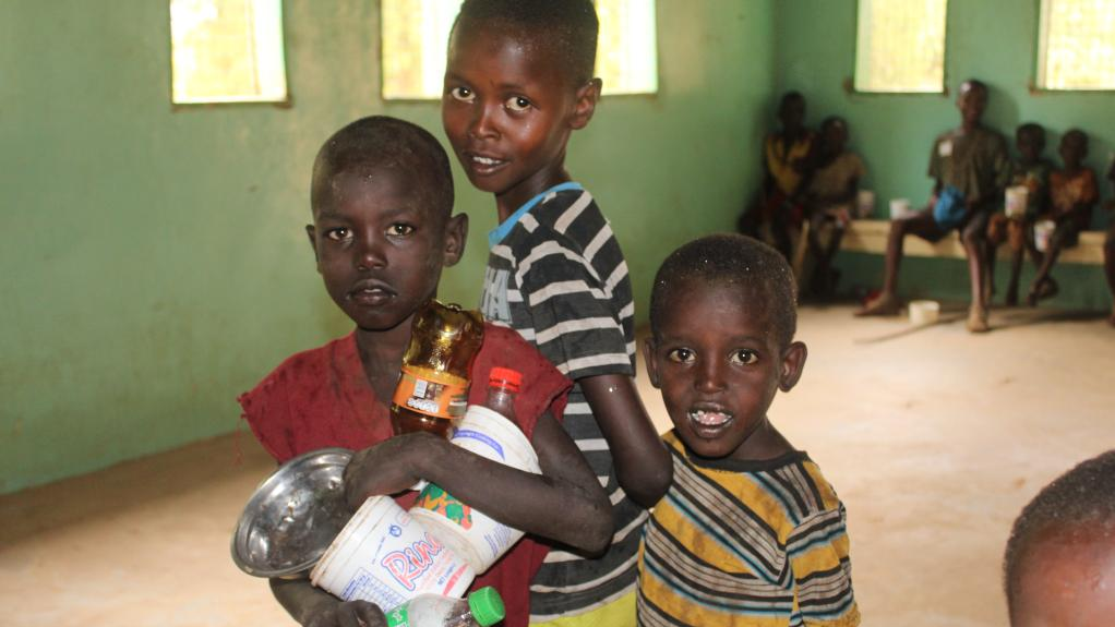 FILE PIC: In this file photo, children are seen carrying food. /Reuters