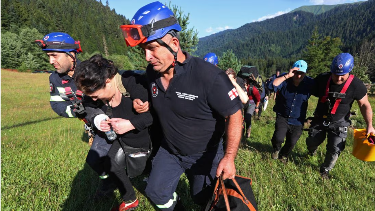 Rescuers evacuate people from the area affected by a landslide in the Racha Region, Georgia August 4, 2023. REUTERS/Irakli Gedenidze