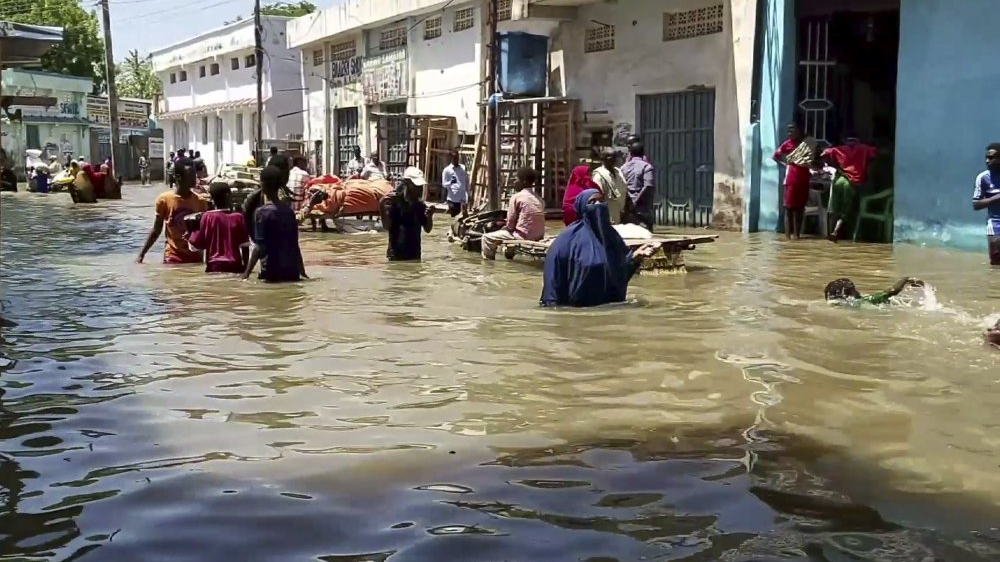 FILE PIC: People wading through flooded waters in Somalia. /Xinhua
