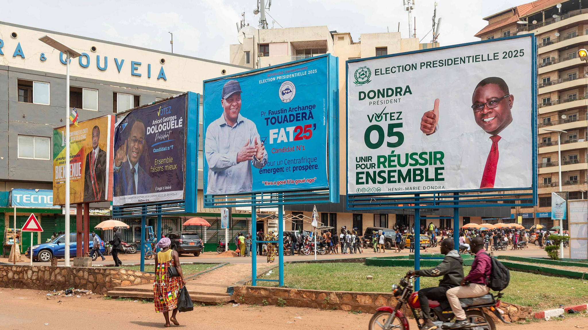A general view of campaign billboards of Central African Republic President and presidential candidate for the United Hearts Movement (MCU), Faustin Archange Touadera (2nd R), presidential candidate for URCA Anicet-Georges Dologuélé (R), and presidential candidate for the Republican Unity (UNIR) Henri-Marie Dondra (2nd L), in Bangui on December 24, 2025. /CFP