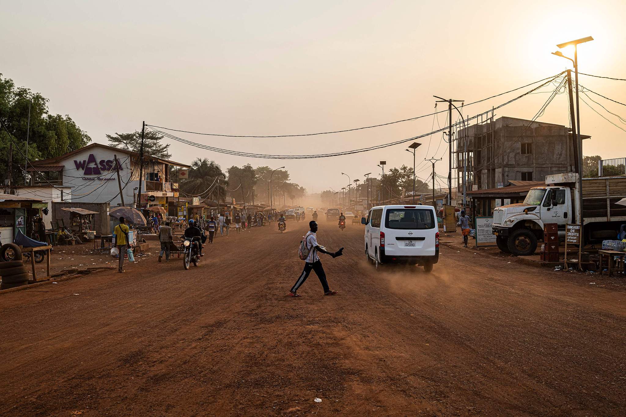 FILE: A man crosses a road as the sun sets in Bangui, on February 28, 2025. /CFP