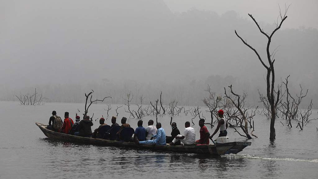 Residents of Manga, in Taraba State are seen on a boat on a river that borders Nigeria and Cameroon, on January 28, 2022. /VCG File Photo