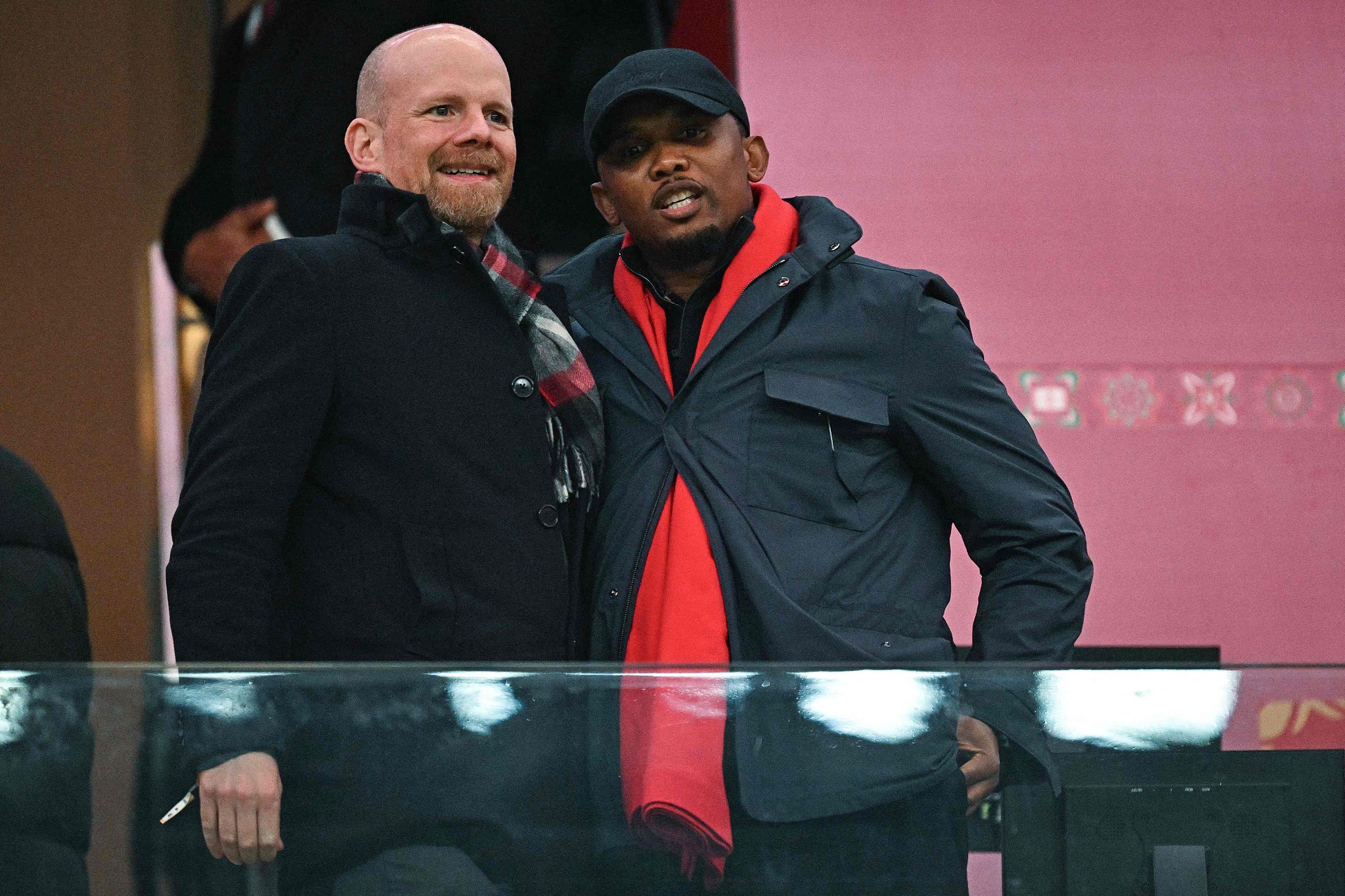 Brazilian Fifa Deputy Secretary General Mattias Grafstrom (L) speaks with President of the Cameroonian Football Federation, Samuel Eto'o, before the Africa Cup of Nations quarter-final football match between Cameroon and Morocco at the Prince Moulay Abdallah Stadium in Rabat, Morocco, January 9, 2026. /CFP