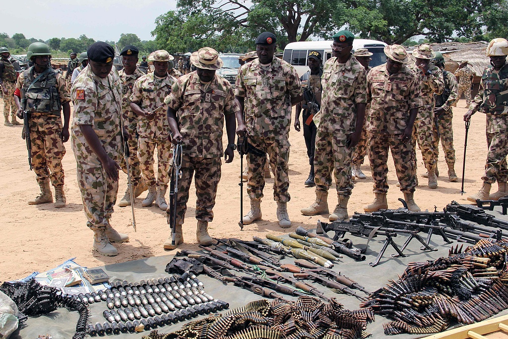 File photo: Nigerian military looking at the weapons seized from Boko Haram. /VCG