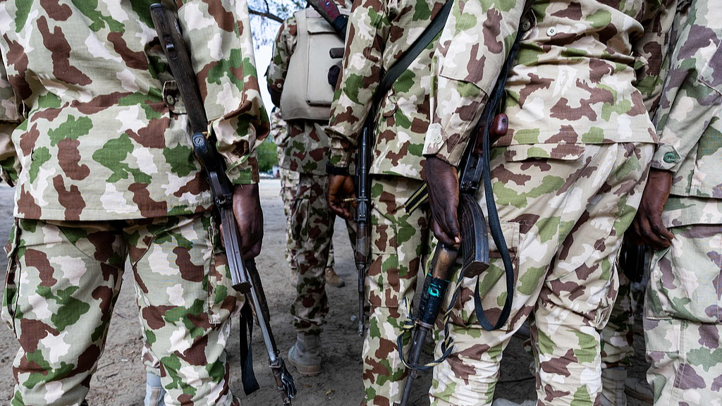 Nigerian soldiers from the Multinational Joint Task Force (MNJTF) hold Kalashnikovs at the MNJTF military base, Sector 3 Headquarters, in Monguno, Borno state, Nigeria, July 5, 2025. /CFP