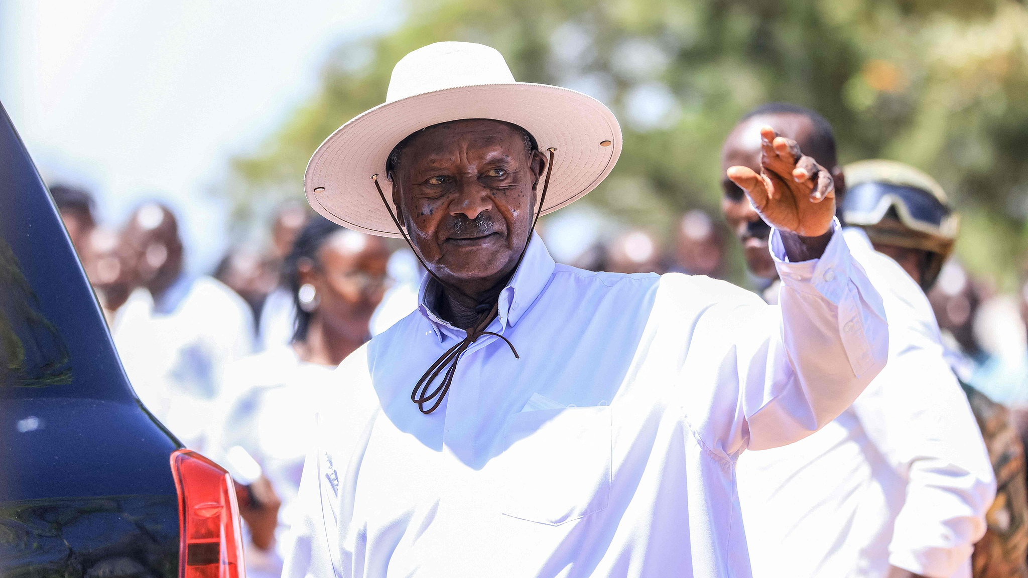 Uganda's incumbent President Yoweri Museveni waves at supporters as he leaves after casting his ballot in Rwakitura during Uganda's 2026 general elections, January 15, 2026. /CFP 

