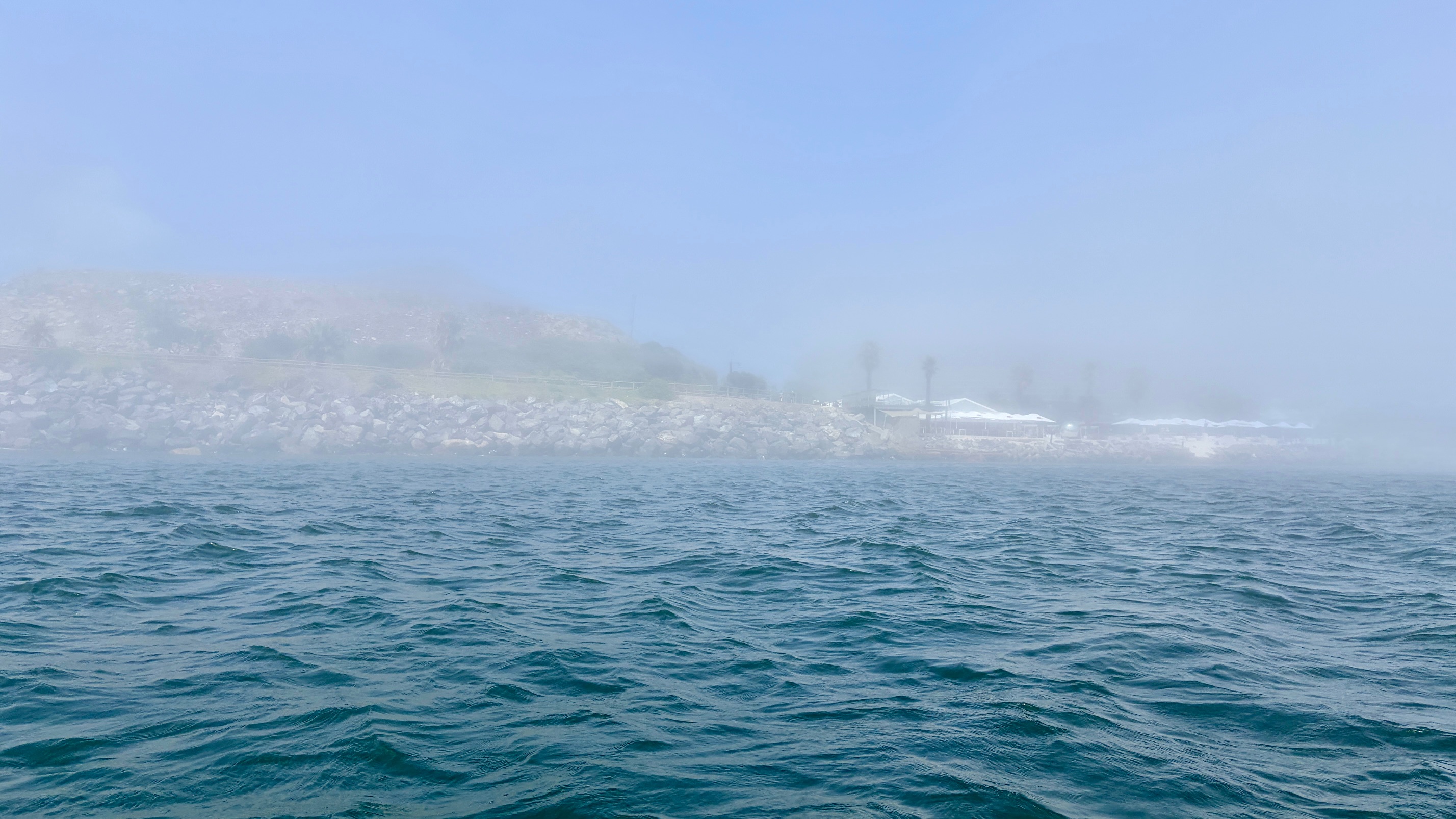 Africa in Pictures: Morning sea fog drapes Cape Town’s waterfront, slowing port activity