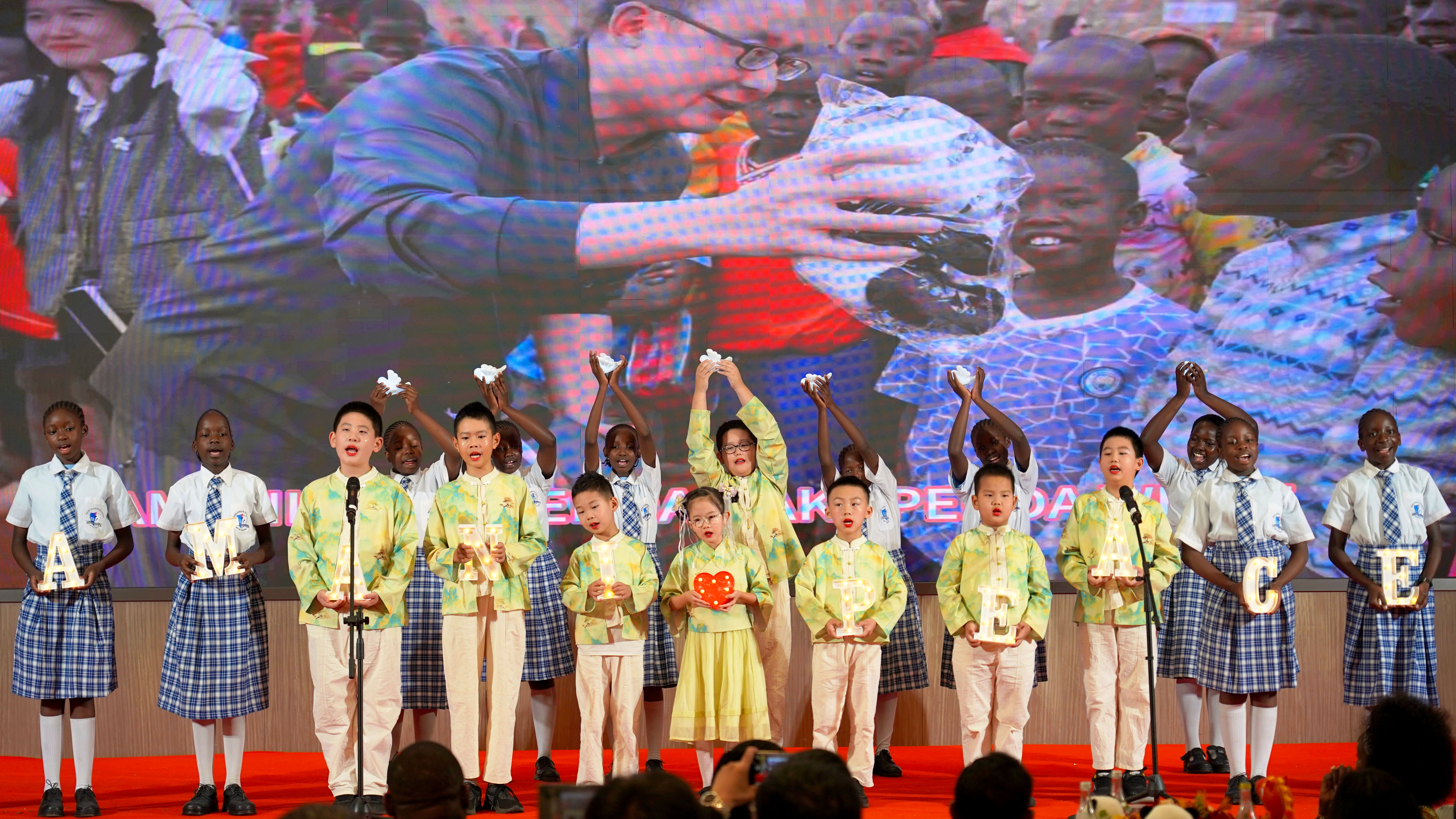 A chorus by Zhu Li, Mei Yuxin and students from Sunrise School of the Chinese Embassy and Bidii Primary School of Kenya perform during the 2026 Chinese New Year Reception and Closing Ceremony of the China-Kenya Culture and Tourism Season in Nairobi, February 10, 2026. /Photo by CGTN Africa's Hong Chuxi