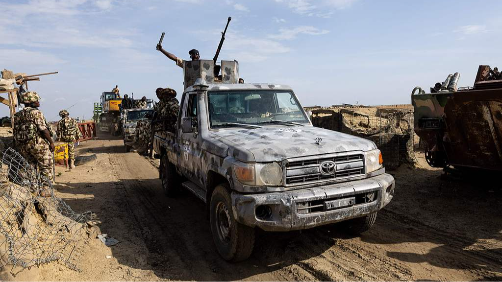 The Multinational Joint Task Force (MNJTF) escorted an excavator through a checkpoint to dig trenches, in Mongno, Borno State, Nigeria, July 4, 2025. /CFP
