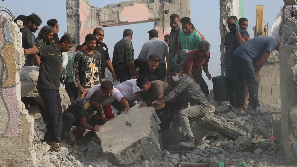 Rescue workers and residents search through the rubble in the aftermath of an Israeli-US strike on a girls' elementary school in
Minab, Iran, February, 28, 2026. /CFP