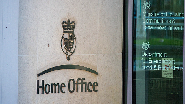The logo of the Home Office is displayed by the entrance door of its headquarters in London, England. /CFP