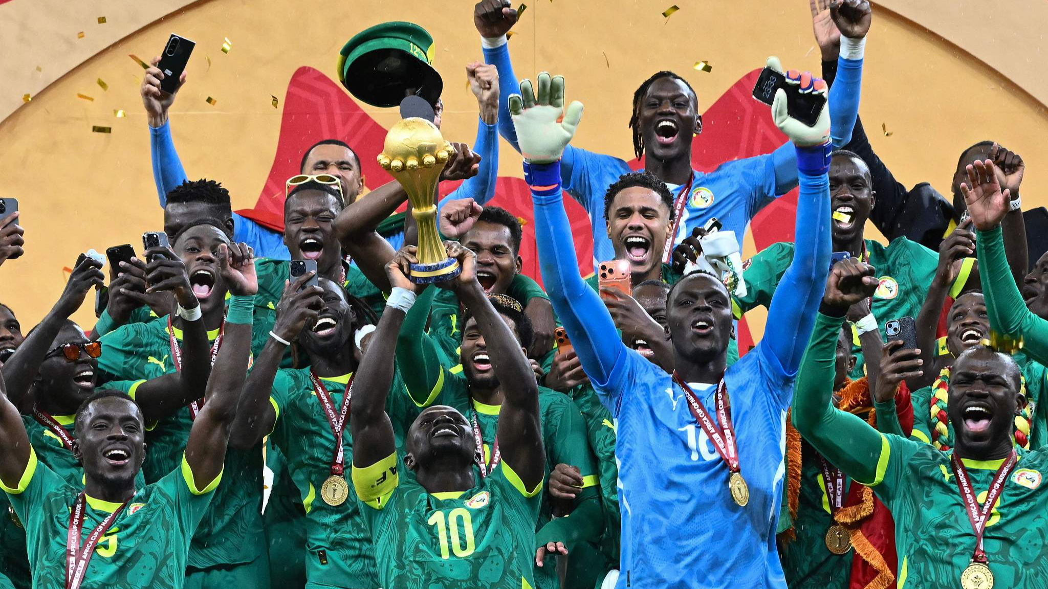 Senegalese striker Sadio Mane celebrated with his teammates by lifting the trophy after the AFCON final match against Morocco at the Prince Moulay Abdullah Stadium on January 18, 2026. /CFP
