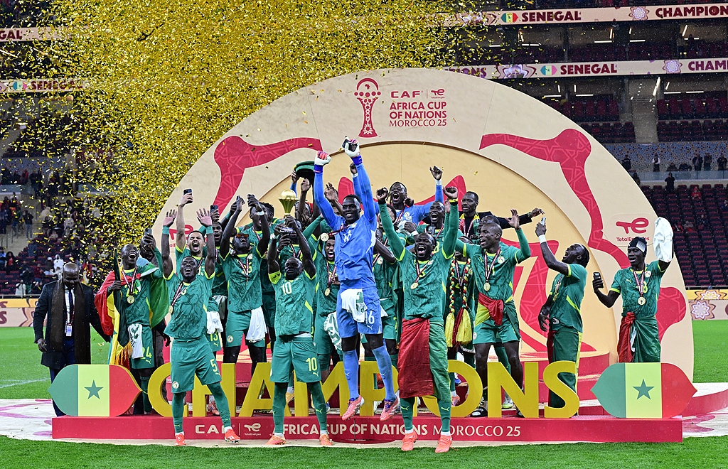 Sadio Mane (C-L) and players of Senegal celebrate with the trophy after winning the CAF Africa Cup of Nations 2025 final match between Senegal and Morocco in Rabat, Morocco, 18 January 2026. /CFP