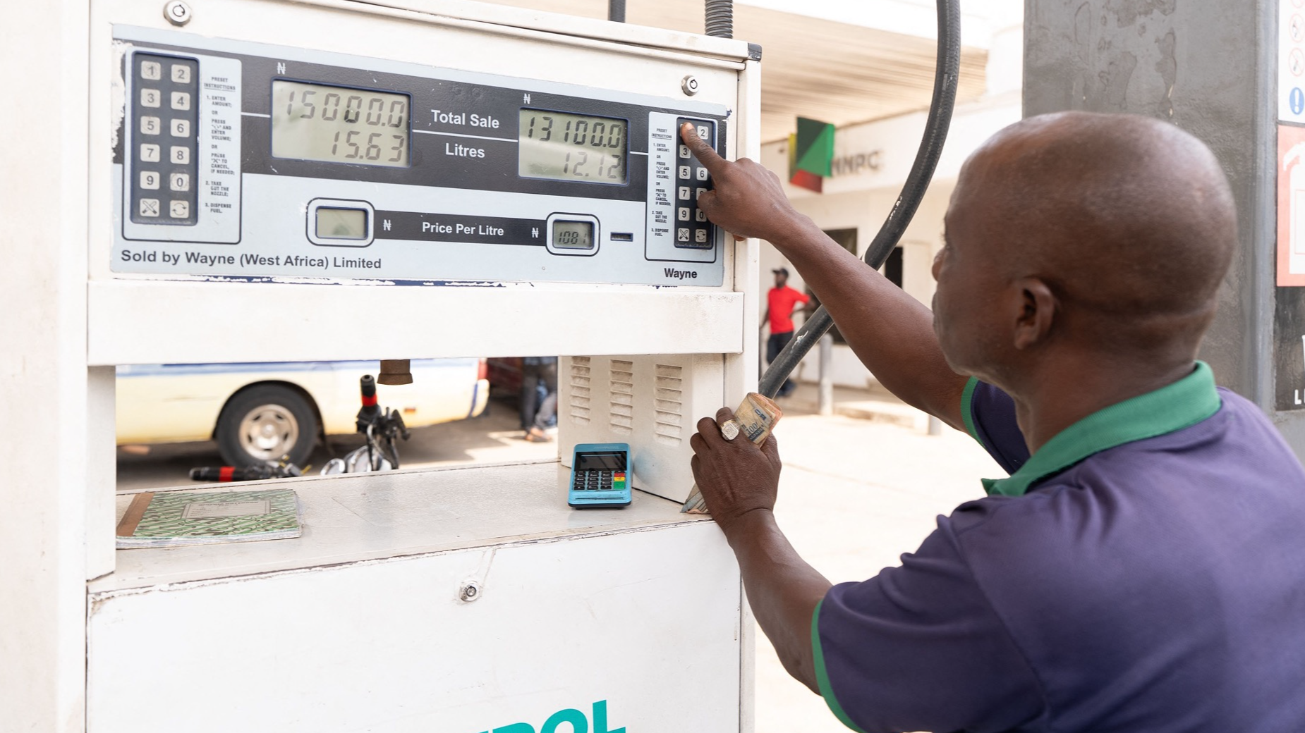A fuel attendant works at a fuel station in Abuja after transport fares rose following the hike in petrol prices on March 9, 2026. /CFP