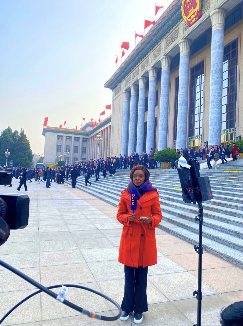 Peninah Karibe reports outside the Great Hall of the People in Beijing, China, in March 2026. /CGTN
