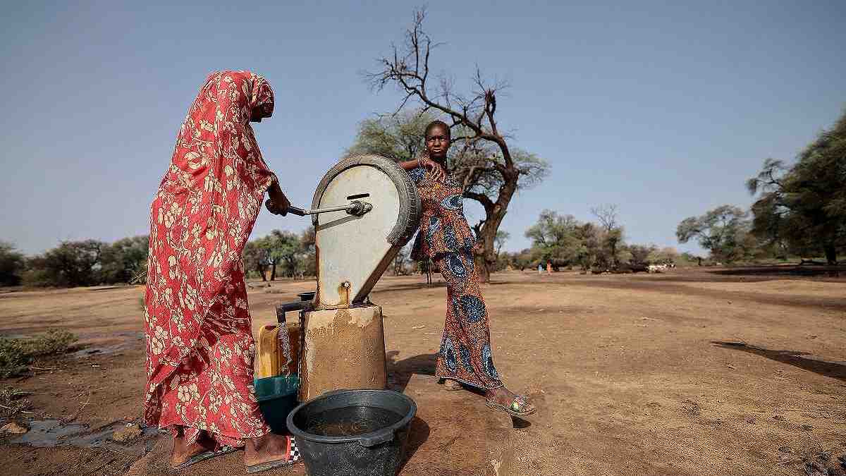 Villagers fill their bucket with water at the rare drinking water point in Ourou Amady Bagga in the Podor region of Senegal, July 8, 2025. /Reuters