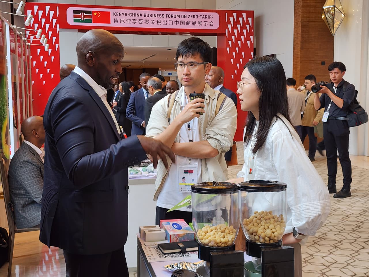 A Kenyan exhibitor talks to Chinese delegates on the sidelines of the Kenya-China Business Forum in Nairobi, Kenya, on March 23, 2026. /CGTN Africa