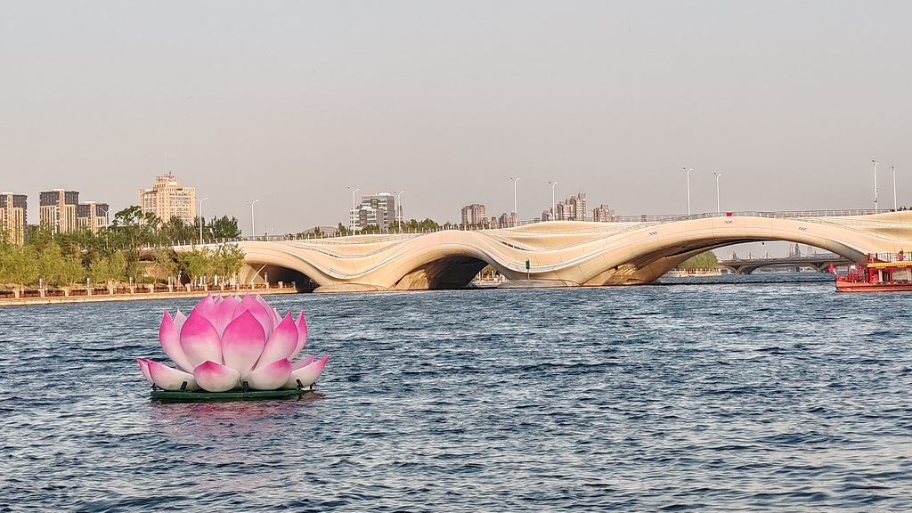 Lotus flower installation floats on the water during the Grand Canal Opening Festival in Tongzhou District, Beijing, April 28, 2025. /CFP