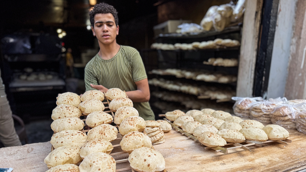 A man prepares bread at the bakery in Cairo, Egypt, 02 December 2025. /CFP