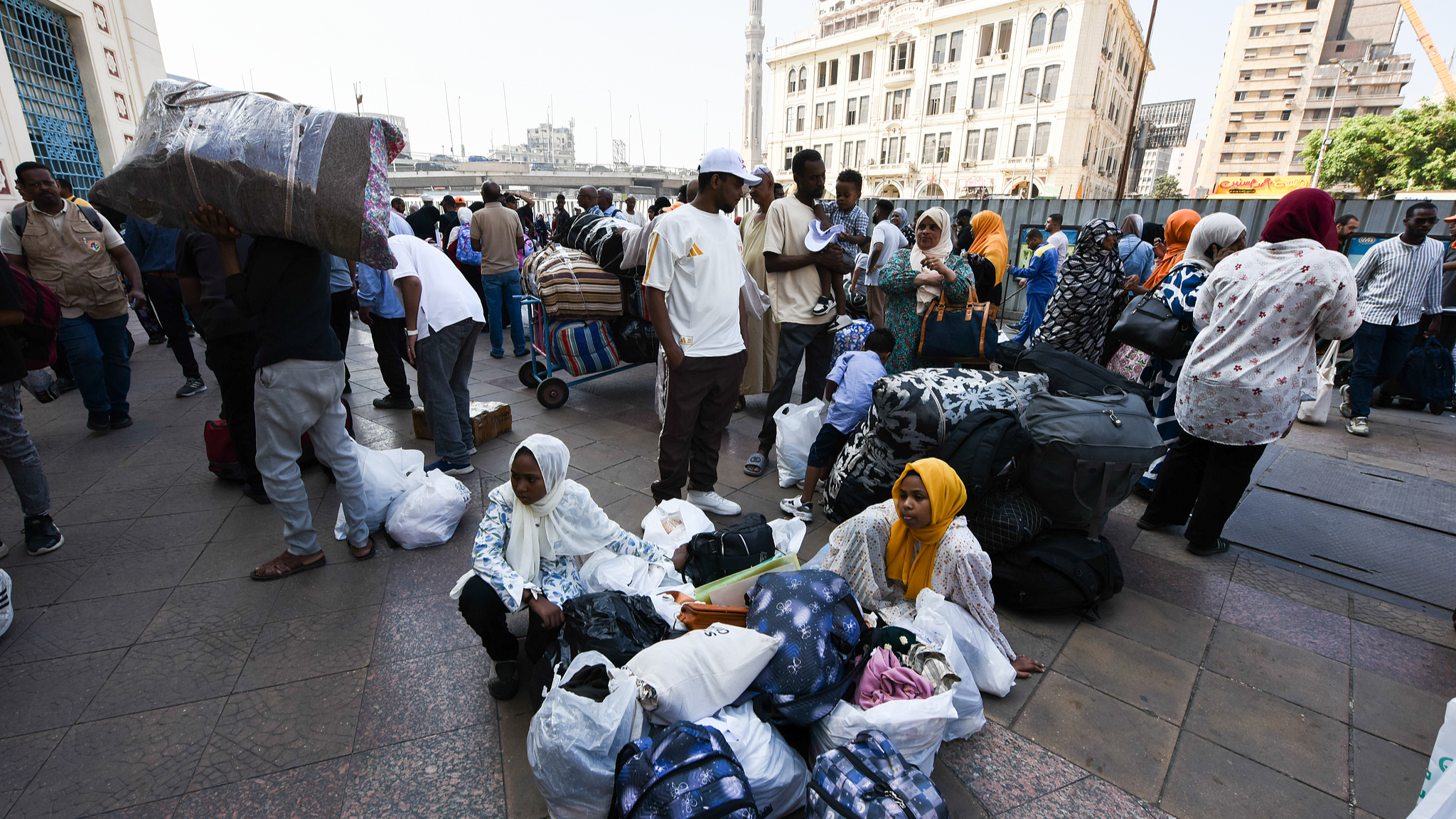 Sudanese refugees board a special train coordinated by the Egyptian government at Cairo's Ramses Station, bound for Aswan, as they voluntarily return to Sudan from Egypt on August 3, 2025. /CFP