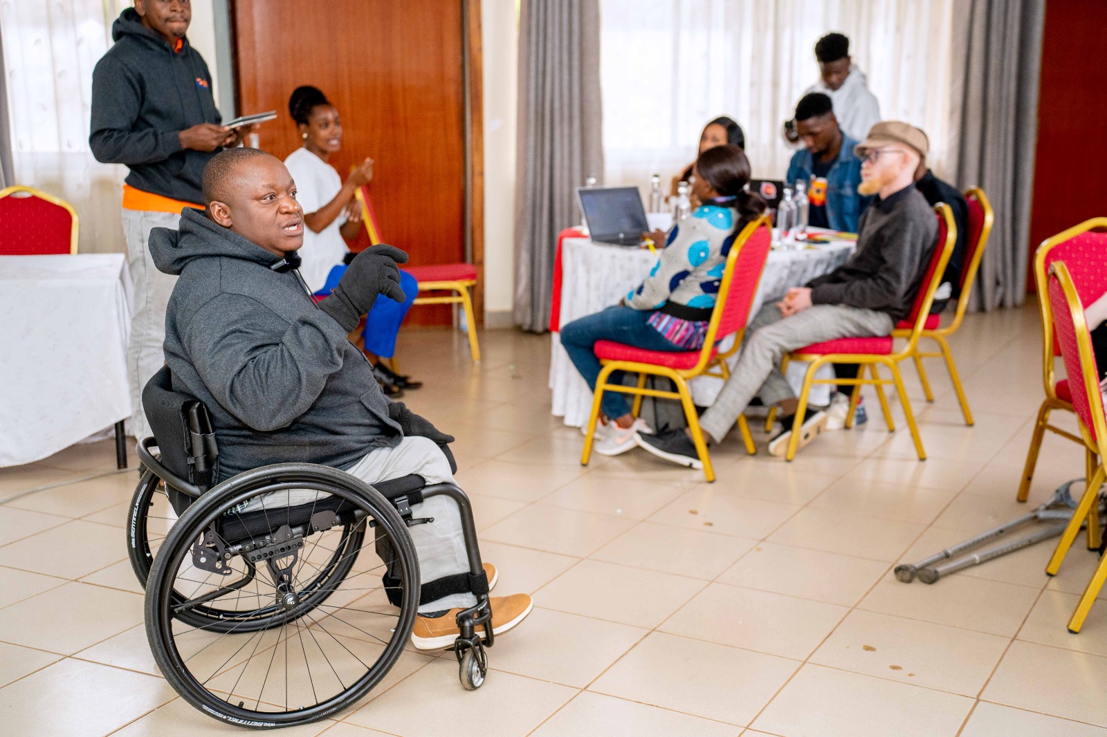 Kennedy Okong'o, Director at Riziki Source, in a wheelchair, engages with persons with disabilities at the Riziki Centre in Nairobi on January 14, 2026. /CGTN Africa