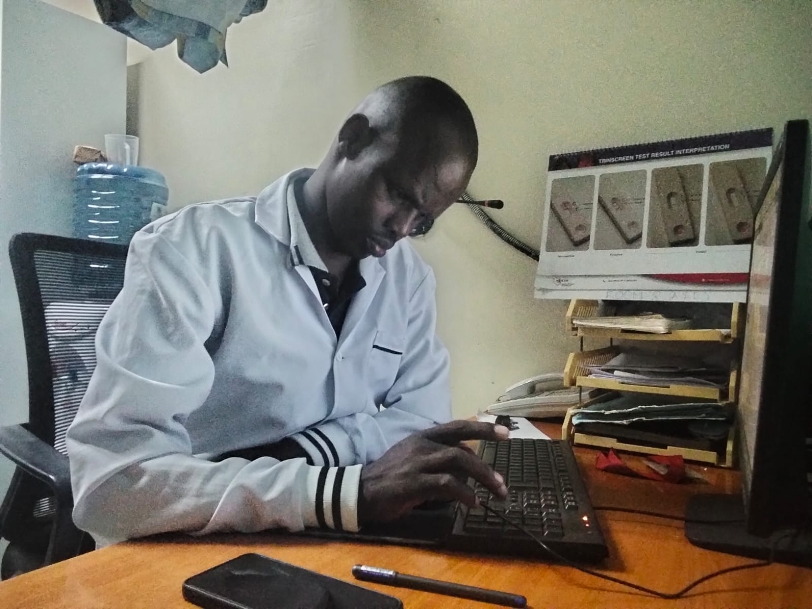 Joseph Mbugua Githiko works on a keyboard at his office in Nairobi, Kenya, on April 3, 2026. /CGTN Africa