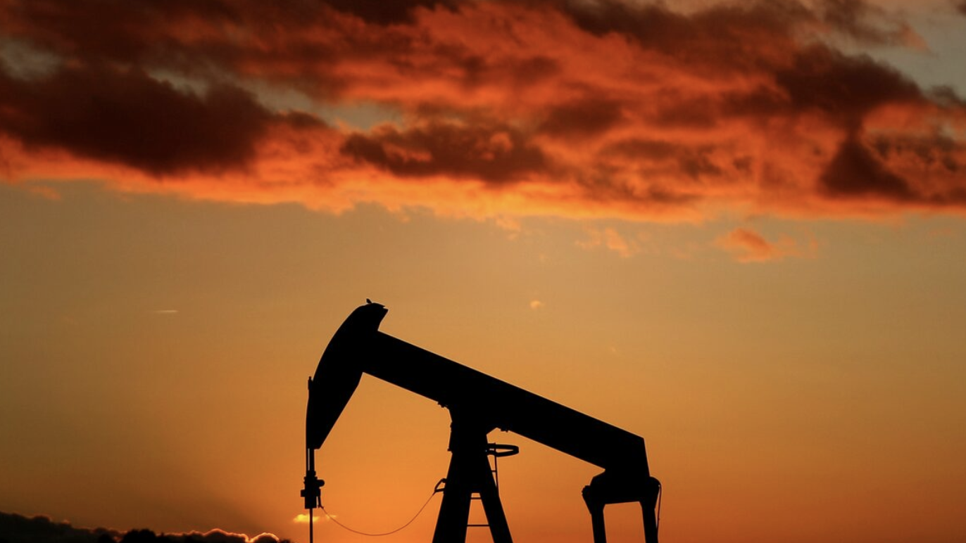 A oil pump is seen at sunset outside Scheibenhard, near Strasbourg, France, October 6, 2017. /Reuters 