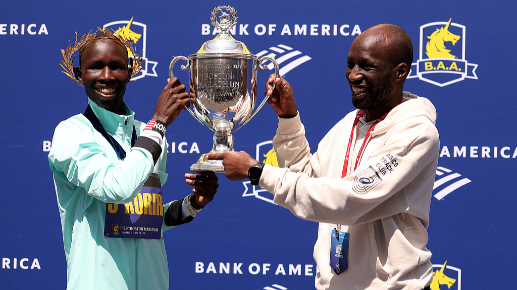 John Korir of Kenya and his brother Wesley pose with the trophy after winning the 129th Boston Marathon Men's division on April 21, 2025, in Boston, Massachusetts, US. /CFP