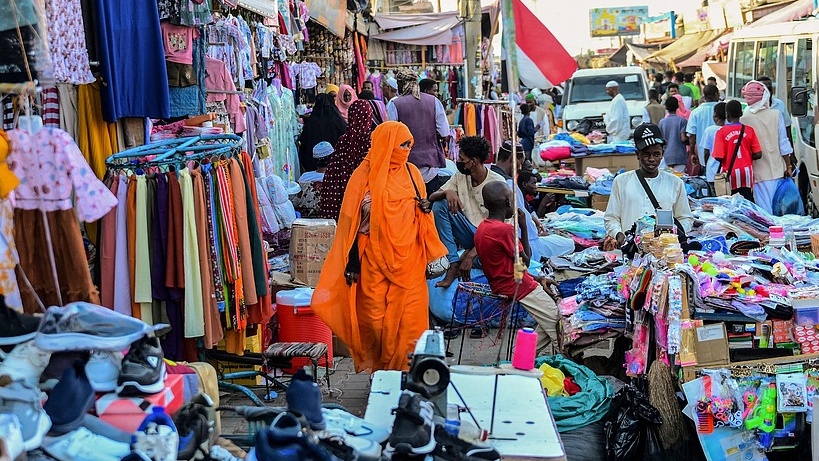 People shop at the main market in Port Sudan on March 14, 2026. /AFP