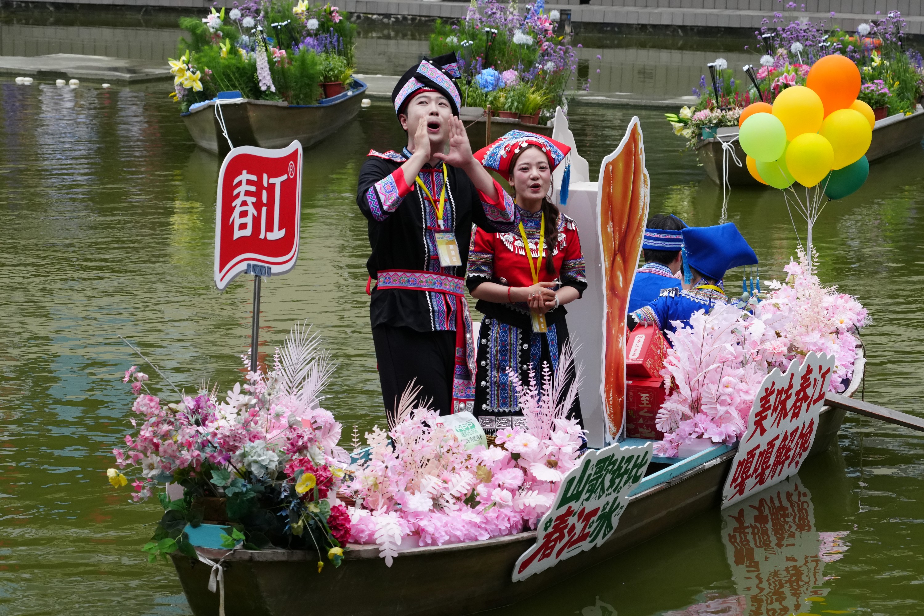 People from South China's Guangxi Zhuang Autonomous Region perform on a boat during March 3 Festival, April 17, 2026. / CMG Guangxi Bureau