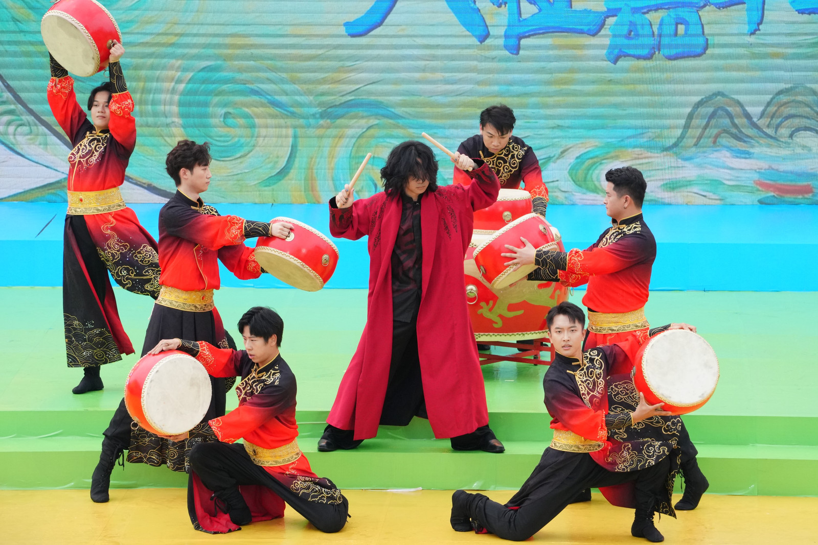 People from South China's Guangxi Zhuang Autonomous Region perform a bench and drum dance for the March 3 Festival, April 17, 2026. / CMG Guangxi Bureau