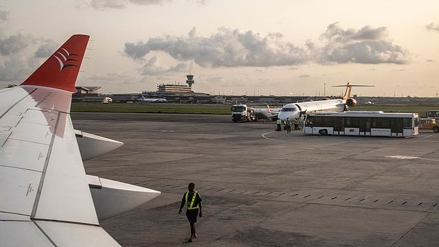Airport staff members walk on the runway at Murtala Muhammed International Airport in Lagos, Nigeria, May 26, 2025. /CFP