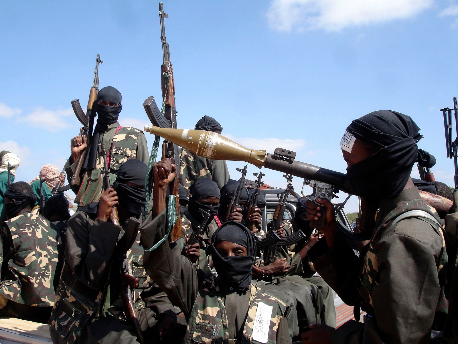 File Photo: Armed al-Shabab fighters ride on pickup trucks outside Mogadishu, Somalia, on December 8, 2008. /CFP