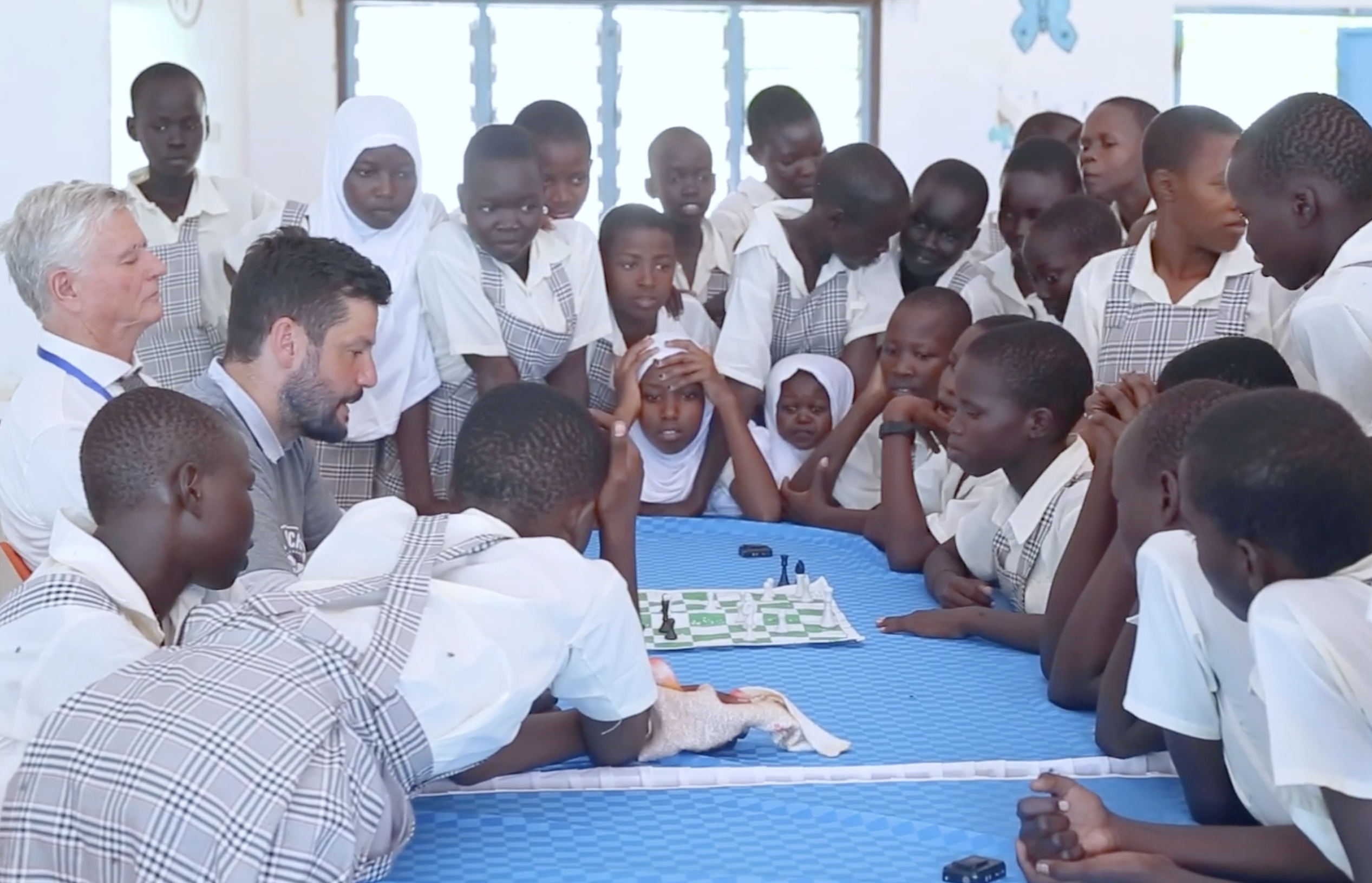 The Gift of Chess founder Russ Makofsky and Kijiji Solutions founder Richard Haukom teach students chess at Kakuma Refugee Camp in Turkana County, Kenya, March 6, 2026. /The Gift of Chess