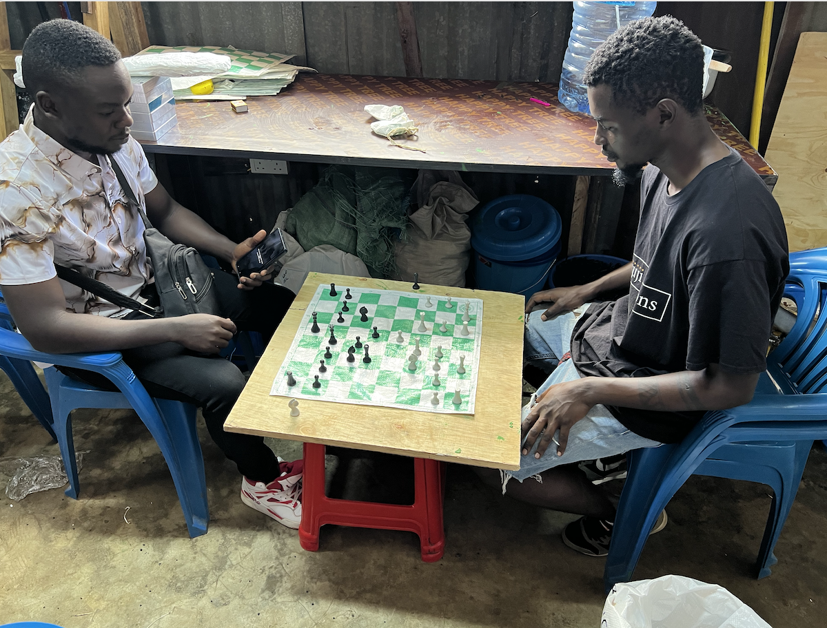 Friends of Kijiji Solutions Chess Works, (L-R) artist Gwako and others, play a friendly chess match at Kijiji House, April 4, 2026. /Kijiji Solutions