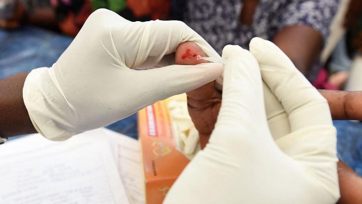 Health official takes blood sample of a woman for malaria testing at Ajah in Eti Osa East district of Lagos, Nigeria on April 21, 2026. /CFP