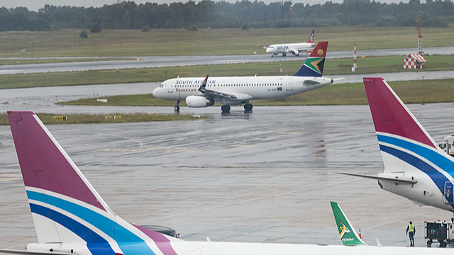 Aircrafts seen parked at a loading bay as seen from the public lookout point at the OR Tambo International Airport in Johannesburg, South Africa, March 12, 2026. /CFP