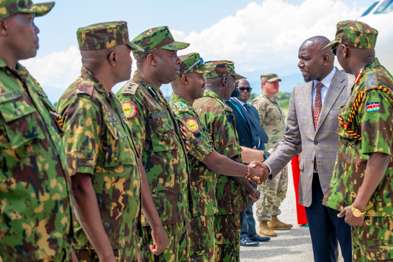Kenya's Interior Cabinet Secretary Kipchumba Murkomen greets police officers in Port-au-Prince, Haiti, on April 27, 2026. /National Police Service of Kenya