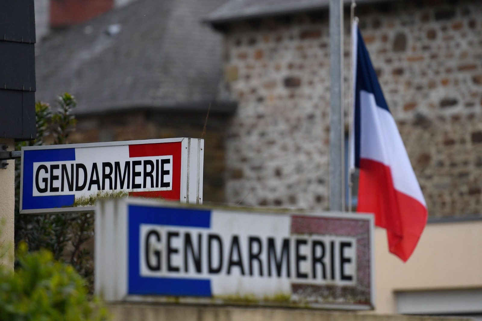 A French flag seen at the gendarmerie in Hédé-Bazouges, suburb of Rennes, western France, March 24, 2018. /AFP